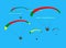 Group of para gliding flying on the sky cloud blue background