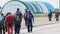 Group of Parachutists Goes to the Plane near the Hangar for a Parachute Jump