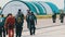 Group of Parachutists Goes to the Plane near the Hangar for a Parachute Jump