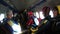 Group of parachutists sits inside a small plane awaiting a jump. Slow Motion