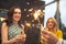Group of partying girls with flutes with sparkling wine and bengal fire