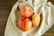 Group of peaches on a beige napkin