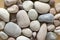 Group of pebbles, light colors, stone background, round and smooth pebbles, simple and harmony texture