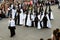 Group of penitents with children in the Easter Week Procession of the Brotherhood of Jesus in his Third Fall on Holy Monday in Zam