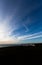 Group of people admire sunset at cliffs edge in East Sussex England