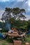 Group of people around the campfire with a beautiful blue sky