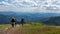 A group of people with backpacks go on the mountains with beautiful scenery