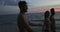 Group Of People Cheerful Talking Walking On Beach At Sunset POV, Happy Frineds On Summer Seaside Holiday