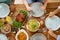 Group of people with chicken and pasta on table