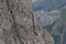 A group of people climbing mountain, mountaineering in Dolomites, Italian Alps