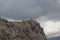 A group of people climbing mountain, mountaineering in Dolomites, Italian Alps