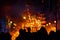 Group of people contemplating how a cardboard monument burns in Valencian Fallas