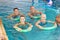 Group of people doing aqua fitness class