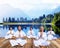 Group of People Doing Meditation near Mountain Range