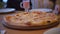 Group of people eat pizza at a cafe. close-up children teens eating fast food in cafe slow motion video