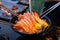 Group of people eating sashimi set in restaurant