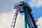 A Group of people enjoy a fast roller coaster ride located at International Drive Area.