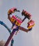 Group of people enjoying a vibrant and exciting ride in an amusement park in Toronto, Canada