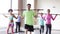 Group of people exercising with bars in gym