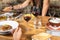 Group of people friends or family caucasian celebrate together and enjoy a table full of fresh and coloured healthy food