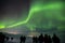 Group of people gather to watch the Aurora Borealis