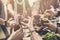 Group of people having meal togetherness dining toasting glasses