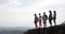 Group Of People Hold Raised Hands On Mountain Top Enjoy Freedom Happy Men And Women Tourists Looking At Landscape