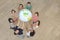 Group of people holding the Earth Globe