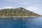 A group of people in kayaks travels near the Kekova Island. Tourists kayaking in the Mediterranean Sea