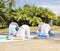 Group of people making yoga exercises outdoors