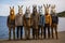 Group of people with masks in a row standing in a field.