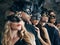 Group of people in masquerade carnival mask posing in studio