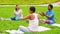 Group of people meeting for yoga class at park