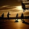 A group of people playing basketball on an outdoor court at sunset, silhouetted by the sun - generative ai