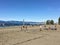 A group of people playing beach volleyball on a beautiful sunny day along the sandy beaches of Spanish Banks, in Vancouver, B.C.