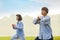 Group of people practice Tai Chi Chuan in a park