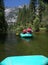 Group of People Rafting Down the River