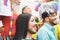 Group of people with rainbow flags and banners during Gay Pride event - Lgbt concept - Focus on transgender face