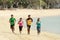 Group of people running on beach, Sport concept