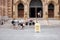 Group of people sitting on the entrance ladders of St. James United Protestant church and church open sign with a lgbt rainbow