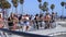 Group of people skateboarding at Venice beach in Los Angeles, United States