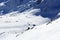 Group of people ski mountaineering and mountain snow panorama in Stubai Alps