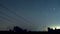 Group of people spending summer night in a field to observe annual Perseids meteor shower