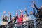 Group of people stand with hands lifted in greet