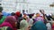 Group of people at street in Amritsar, back side view of covered heads.
