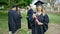 Group of people students graduated holding diploma at university campus