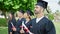 Group of people students graduated holding diploma at university campus