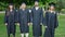 Group of people students graduated standing together at university campus