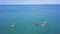 Group of people swim on SUP Board. Clip. Beautiful seascape with people resting on water with SUP boards. Top view of