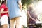 Group of people toasting beers celebration and having barbecue party outdoors garden